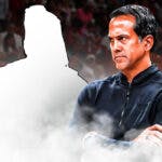 Miami Heat head coach Erik Spoelstra looking at a silhouette of Delon Wright in front of the Kaseya Center.