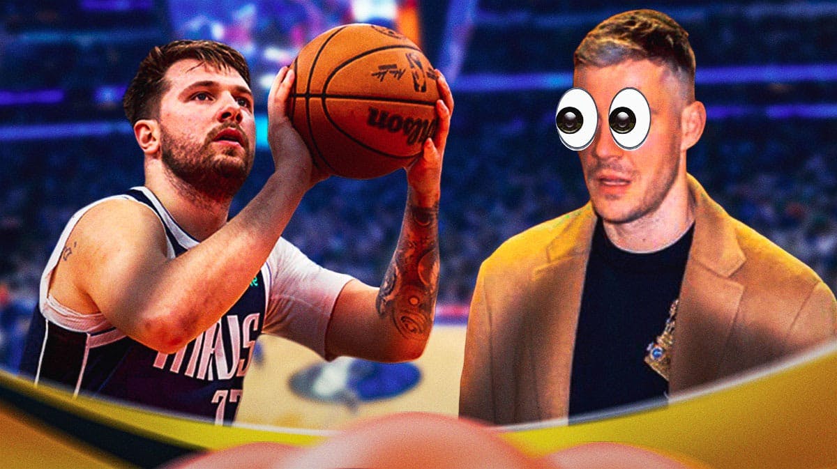 Goran Dragic (normal clothes) eyes popping out looking at Mavericks' Luka Doncic shooting a basketball.
