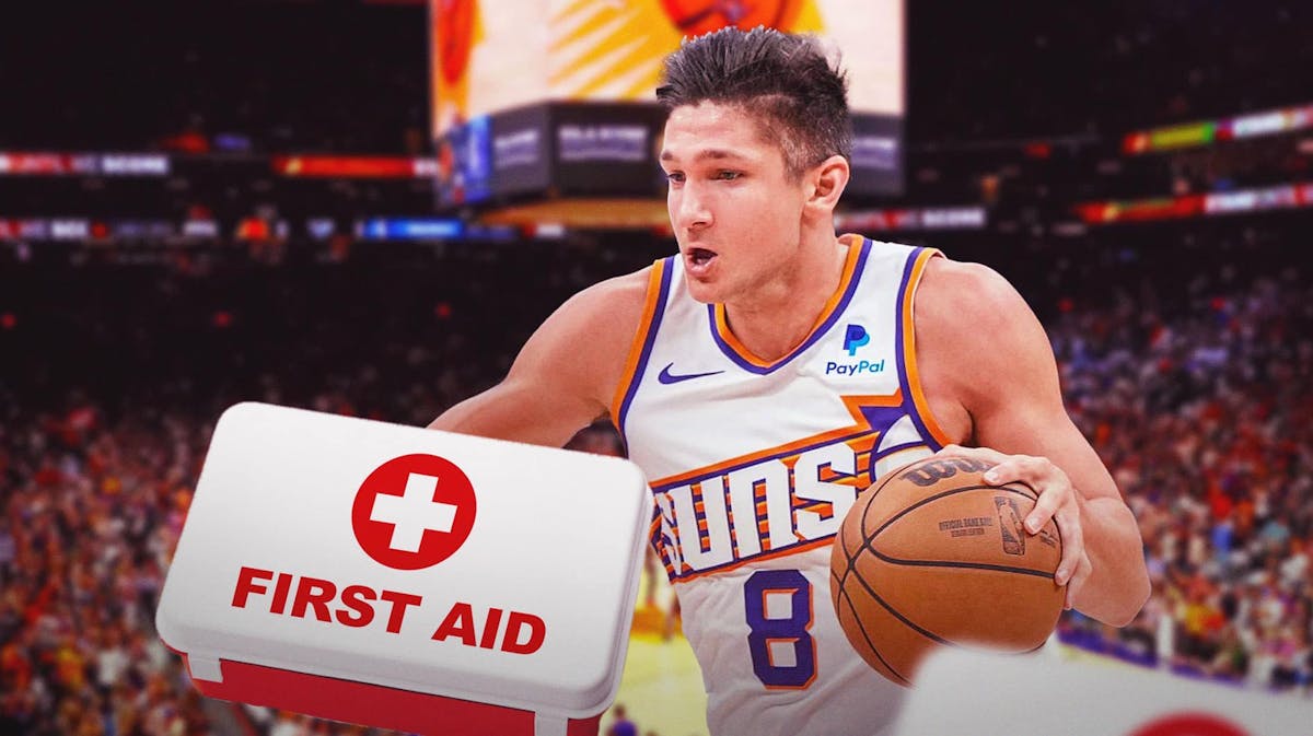 Suns' Grayson Allen with medical kit next to him