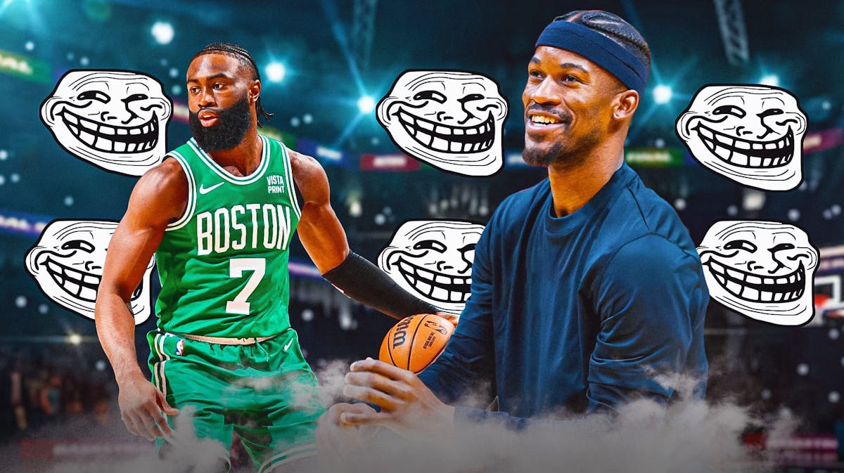 Heat's Jimmy Butler smiling (in casual clothes), with Celtics' Jaylen Brown beside him and the classic troll face all over the picture