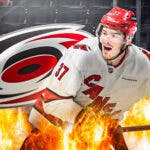Andrei Svechnikov in middle of image looking happy with fire around him, Carolina Hurricanes logo, hockey rink in background