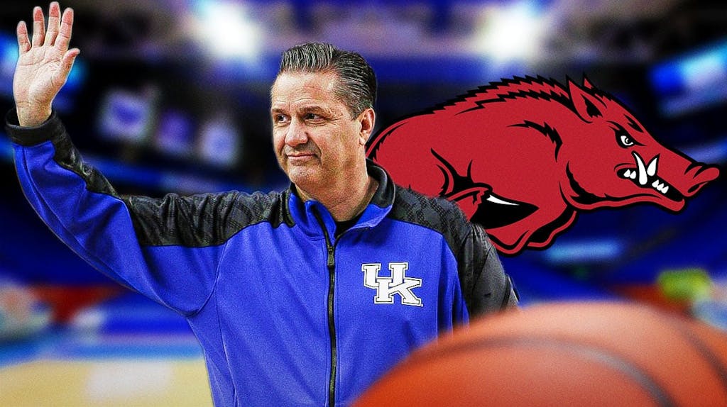 Kentucky basketball coach John Calipari looking at Arkansas logo.