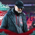 Jurgen Klopp looking down/sad in front of the Liverpool and Premier League logos
