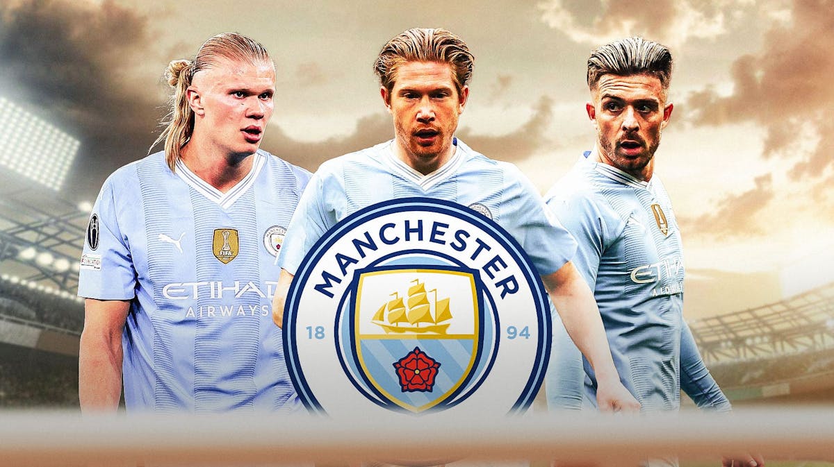 Erling Haaland, Kevin de Bruyne and Jack Grealish all looking at the middle at the Manchester City logo