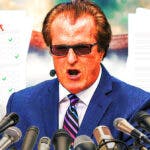 Mel Kiper Jr. in front of two papers with A grades.