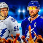 Mikhail Sergachev on one side, Steven Stamkos on the other side with stars in his eyes