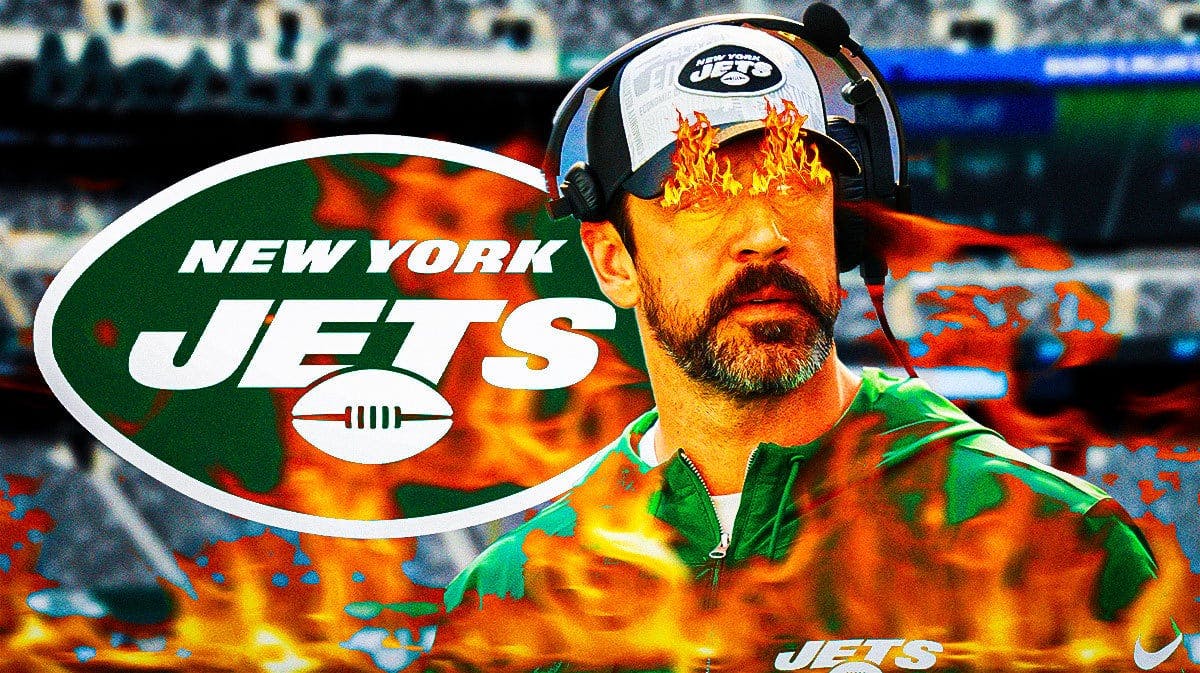 Jets Aaron Rodgers with fire in his eyes and surrounded by fire