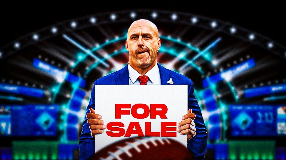 Cardinals GM Monti Ossenfort holding a "FOR SALE" sign in front of a 2024 NFL Draft background