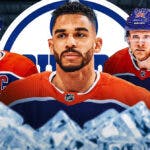 Evander Kane in middle of image looking stern, Connor McDavid and Corey Perry on either side, Edmonton Oilers logo, hockey rink in background