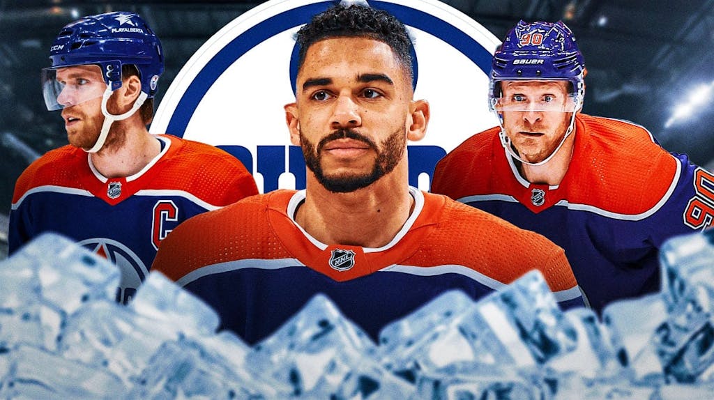 Evander Kane in middle of image looking stern, Connor McDavid and Corey Perry on either side, Edmonton Oilers logo, hockey rink in background