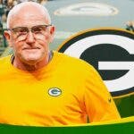 Gordon Batty smiling, Green Bay Packers logo in the background.