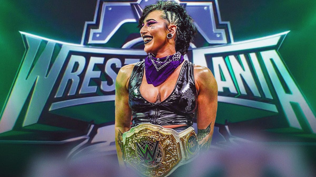 Rhea Ripley with the Woman's World Championship belt and the WrestleMania 40 logo as the background.
