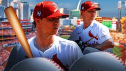 Sonny Gray holding baseball in Cardinals jersey