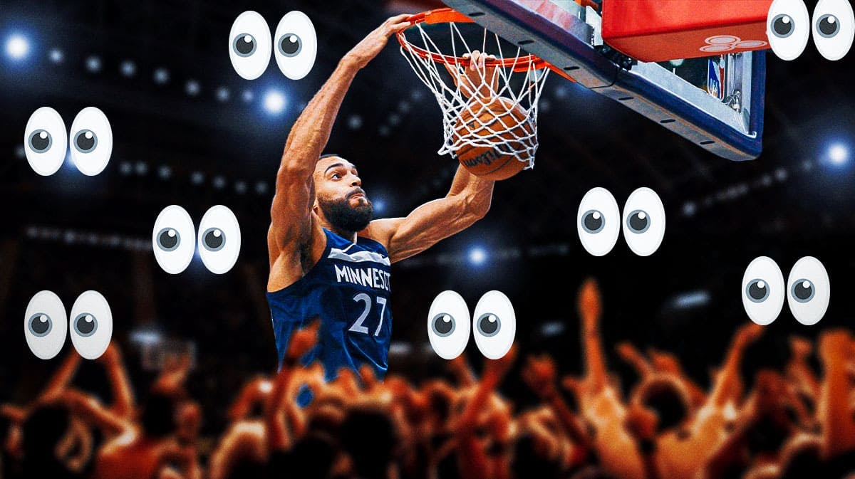 Timberwolves' Rudy Gobert dunking a basketball. Place the eyes emoji all around him.