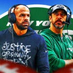 New York Jets head coach Robert Saleh and QB Aaron Rodgers with the New York Jets logo between them