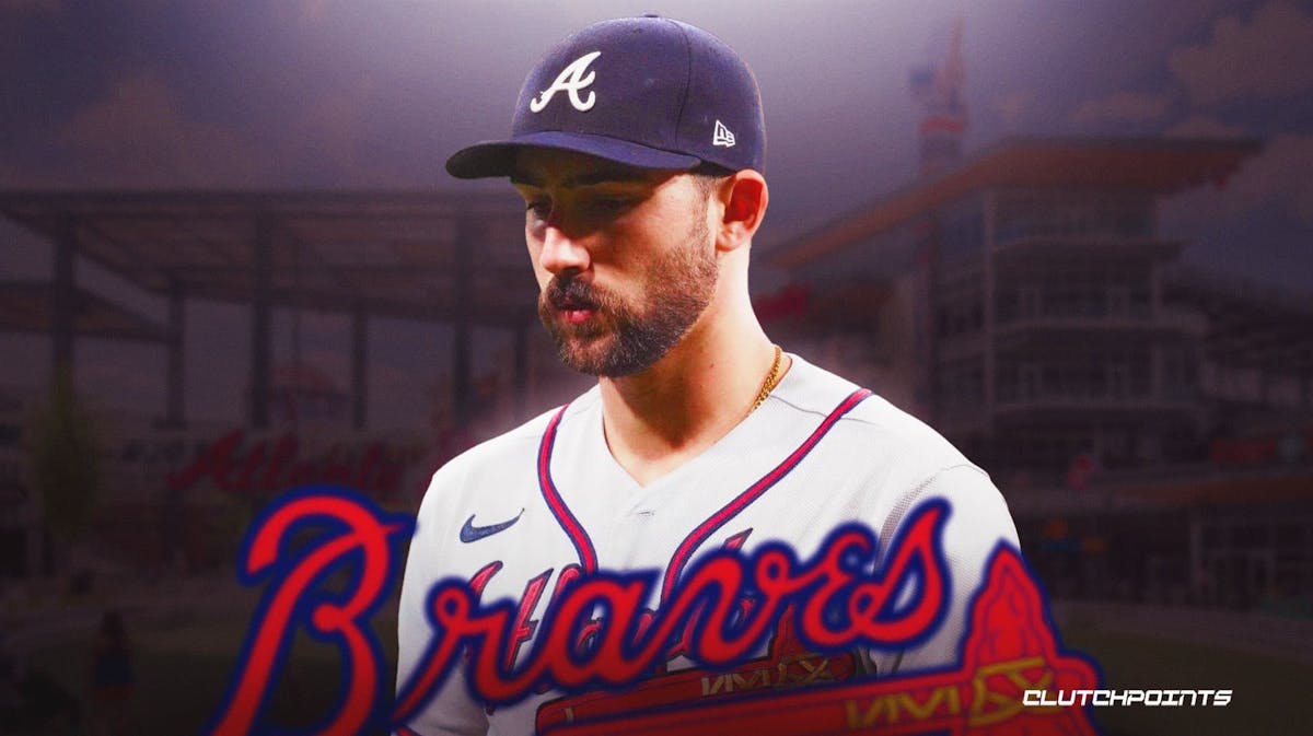 Braves' Spencer Strider looking sad with Braves logo in front