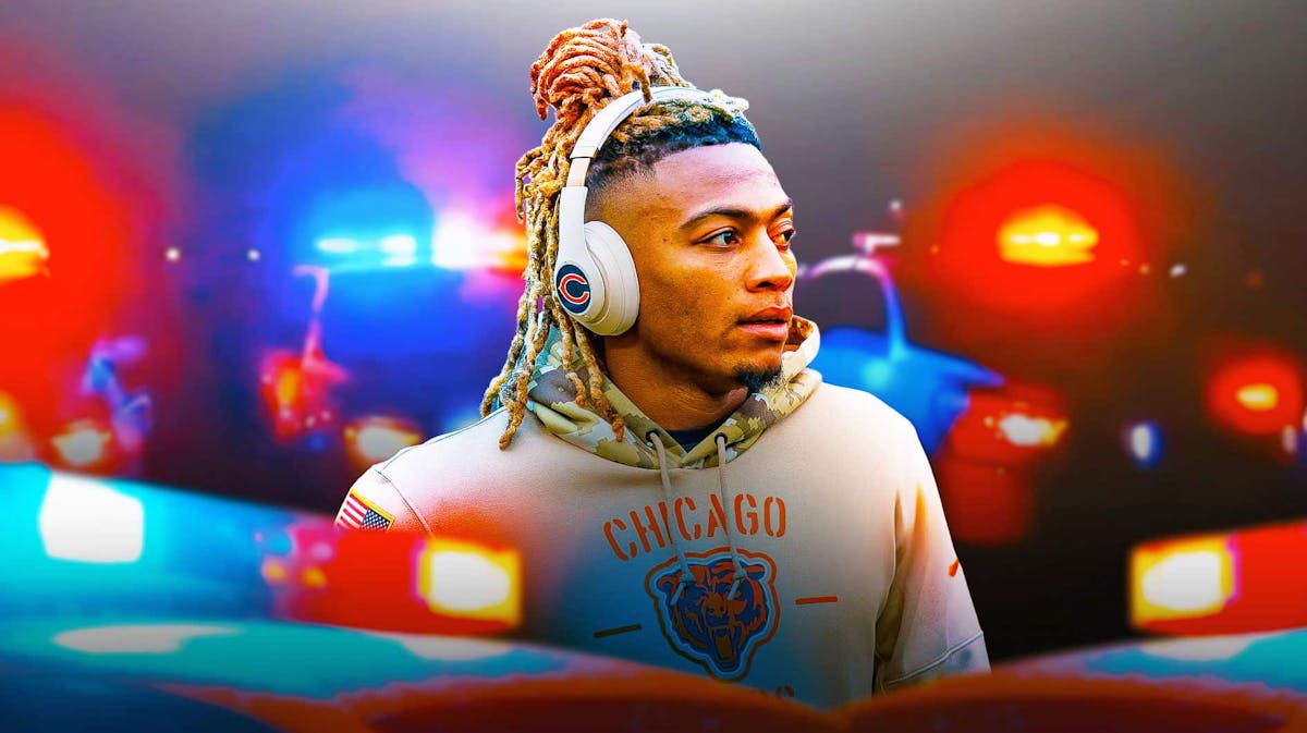 Buster Skrine (Former Bears player) looking serious with police lights in the background