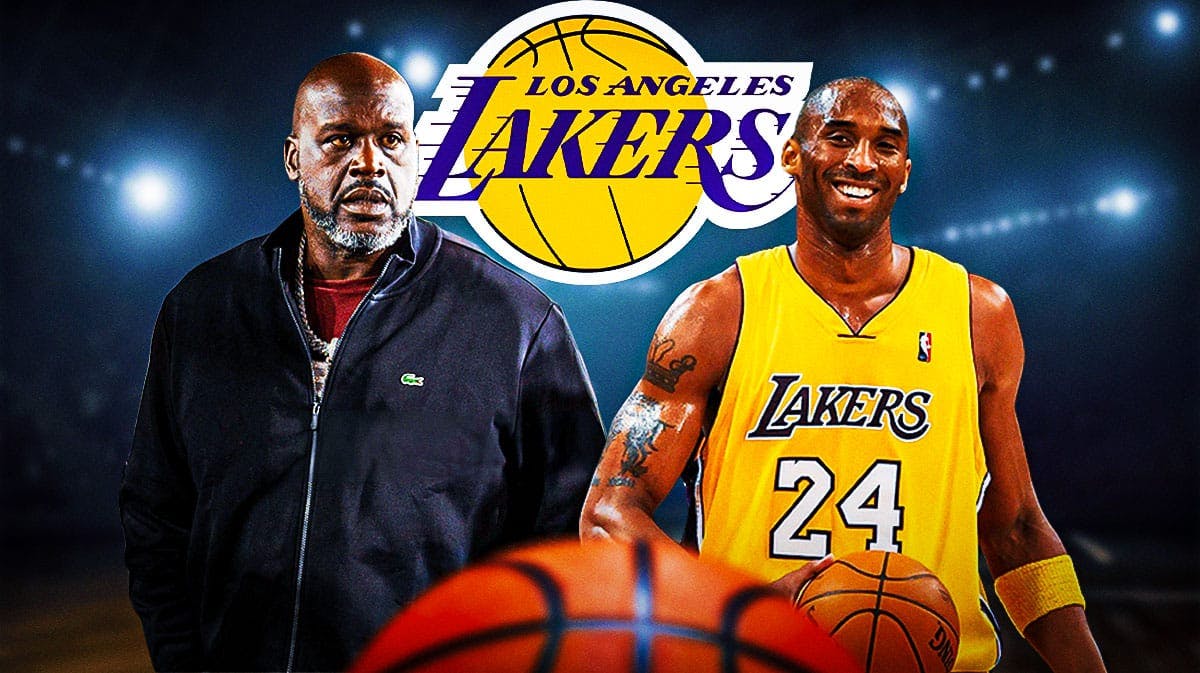 Lakers' Shaquille O'Neal stands next to Kobe Bryant with GOAT signs in background