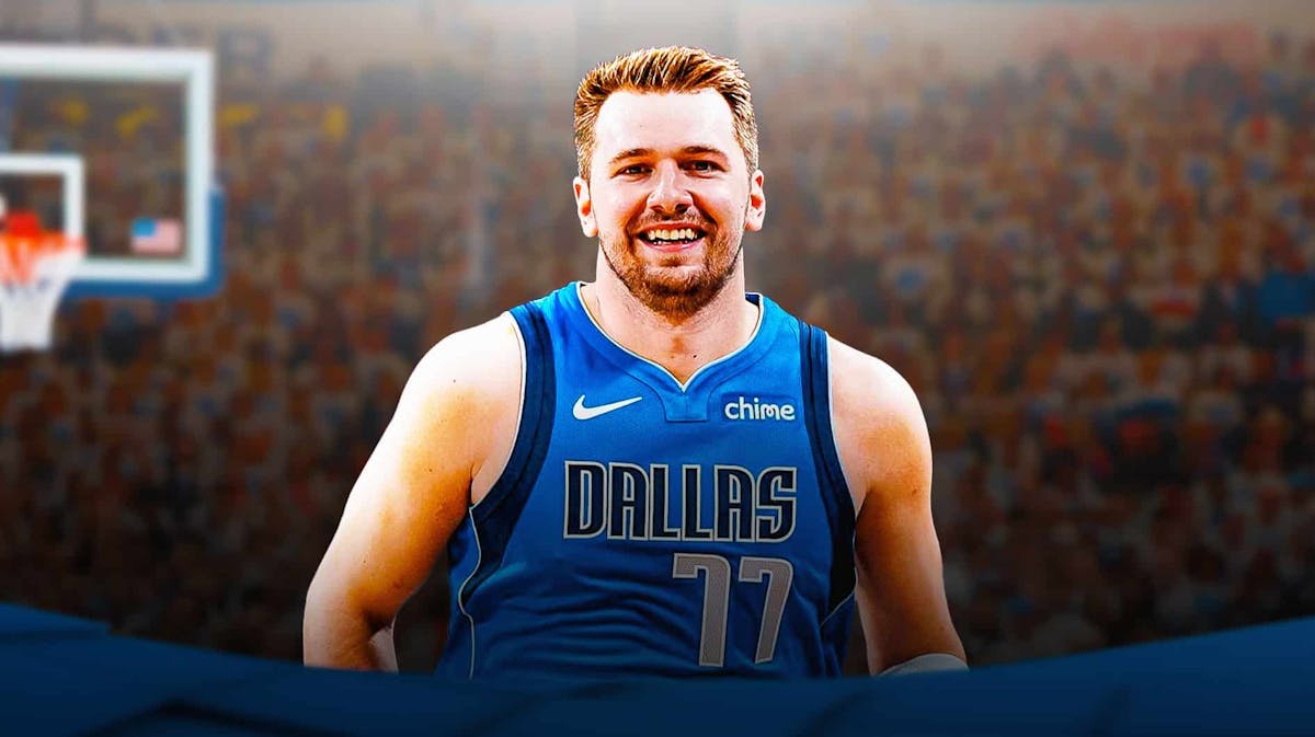 Mavericks' Luka Doncic smiling at Paycom Center with Thunder fans in background.