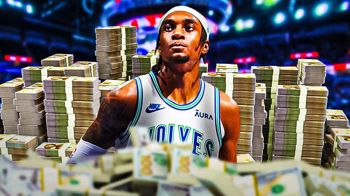 Jaden McDaniels surrounded by piles of cash.
