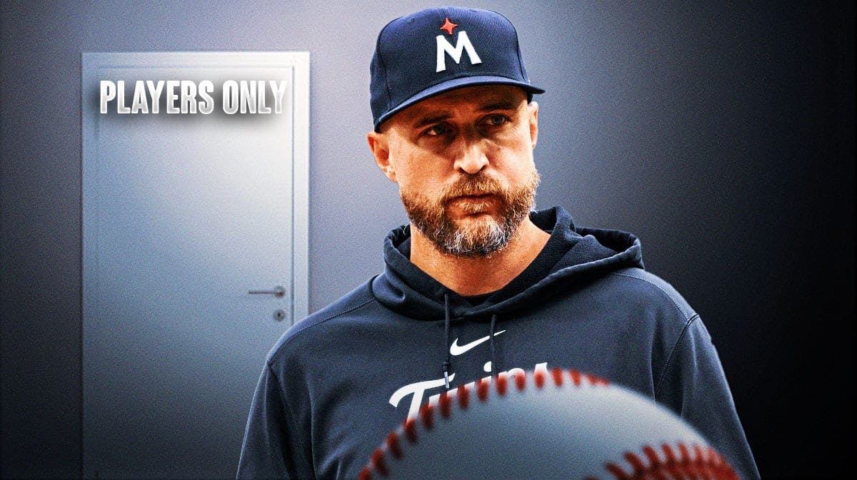 Minnesota Twins manager Rocco Baldelli with a door next to him that says Players Only